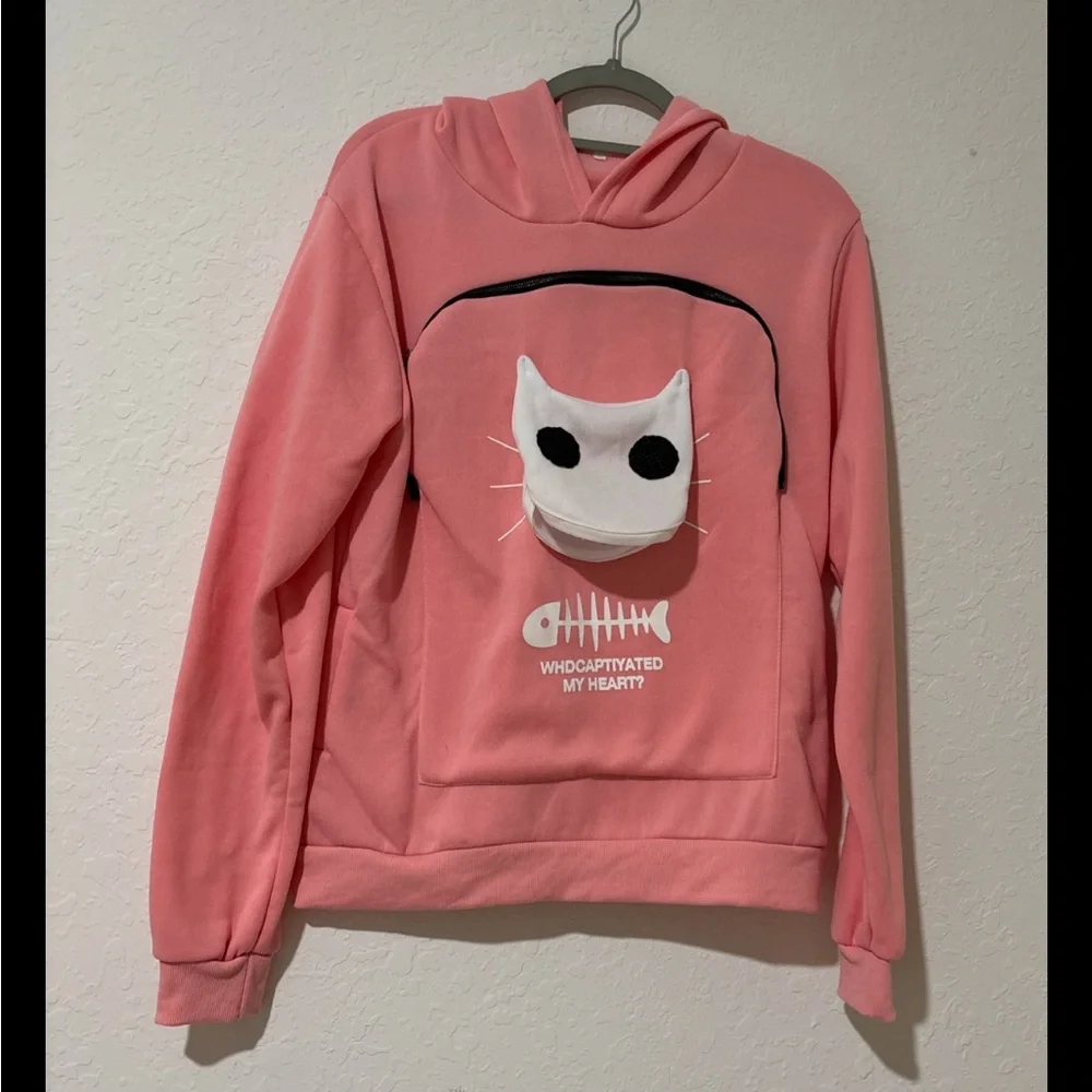 Pink sweatshirt that you can hold a small pet in.